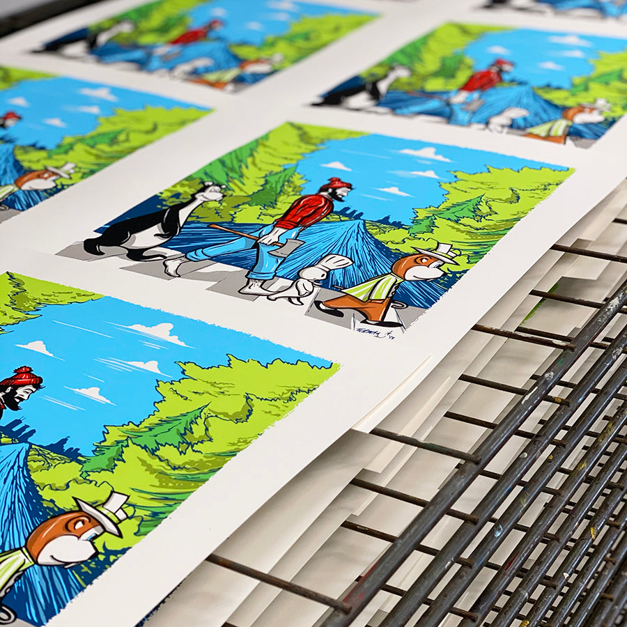 Screen Printing Services Minnesota - a group of pictures on a rack